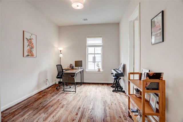 1348 W 25th St, Houston, TX 77008 - office area with wood finished floors and baseboards
