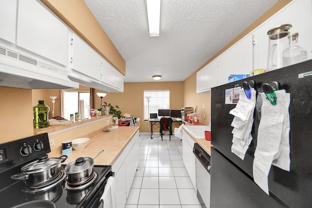 2750 Holly Hall St Unit 1104, Houston, TX 77054 - kitchen featuring black appliances, white cabinetry, light countertops, a sink, and under cabinet range hood