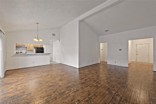 6493 Alisa Ln, Houston, TX 77084 - unfurnished living room featuring a chandelier, dark wood-style flooring, a textured ceiling, and high vaulted ceiling