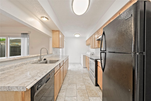 6493 Alisa Ln, Houston, TX 77084 - kitchen featuring black appliances, a sink, light brown cabinets, light countertops, and a textured ceiling