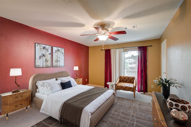 14911 Wunderlich Dr Unit 1007, Houston, TX 77069 - bedroom with dark colored carpet, a textured wall, and ceiling fan