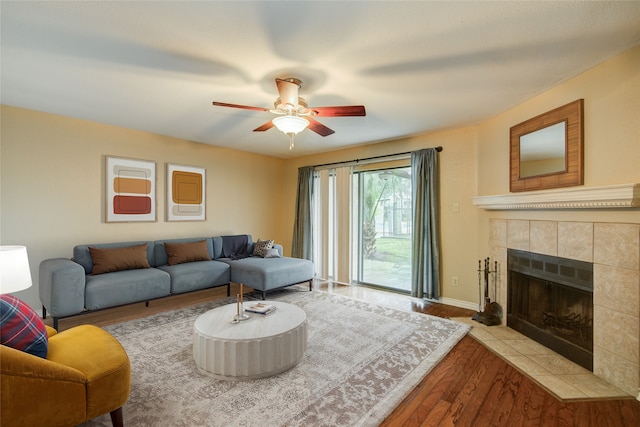 14911 Wunderlich Dr Unit 1007, Houston, TX 77069 - living room with wood finished floors, a fireplace, ceiling fan, and baseboards