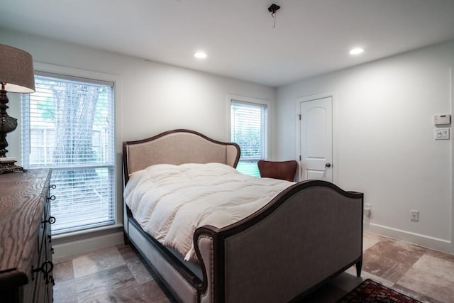 5631 Winsome Ln, Houston, TX 77057 - bedroom featuring multiple windows, recessed lighting, and baseboards