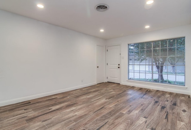 5631 Winsome Ln, Houston, TX 77057 - spare room featuring wood finished floors, baseboards, and recessed lighting
