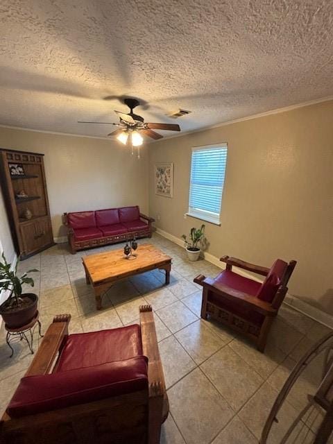 1001 Ivy Ave, Deer Park, TX 77536 - living room featuring a textured ceiling, ceiling fan, crown molding, light tile patterned floors, and baseboards