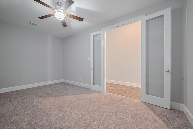 2206 Umber Oaks Ln, Brookshire, TX 77423 - unfurnished bedroom with carpet, french doors, baseboards, and ceiling fan