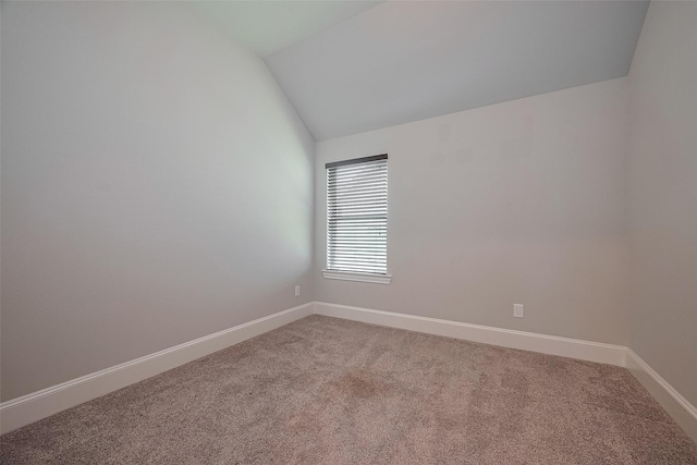 2206 Umber Oaks Ln, Brookshire, TX 77423 - spare room with vaulted ceiling, light carpet, and baseboards