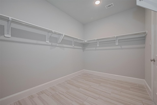 2206 Umber Oaks Ln, Brookshire, TX 77423 - spacious closet featuring light wood-style flooring