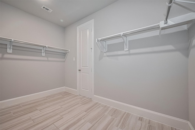 2206 Umber Oaks Ln, Brookshire, TX 77423 - walk in closet featuring light wood finished floors