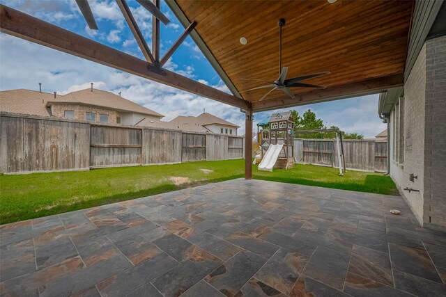 2206 Umber Oaks Ln, Brookshire, TX 77423 - view of patio / terrace featuring a playground and ceiling fan