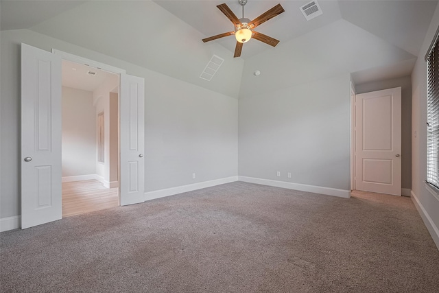 2206 Umber Oaks Ln, Brookshire, TX 77423 - carpeted empty room with a ceiling fan, vaulted ceiling, and baseboards