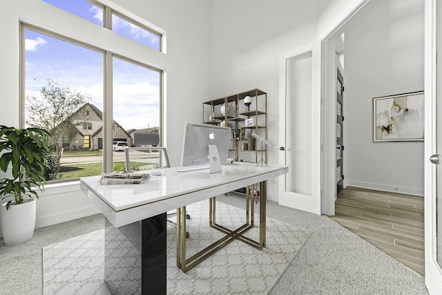 30419 Bermuda Hallow Bnd, Fulshear, TX 77423 - home office with baseboards and light wood-style flooring