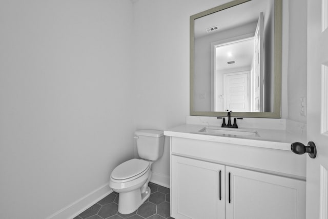 30419 Bermuda Hallow Bnd, Fulshear, TX 77423 - bathroom with toilet, vanity, tile patterned floors, and baseboards