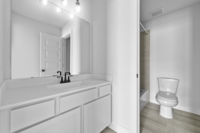 30419 Bermuda Hallow Bnd, Fulshear, TX 77423 - bathroom featuring vanity, toilet, baseboards, and shower / tub combination
