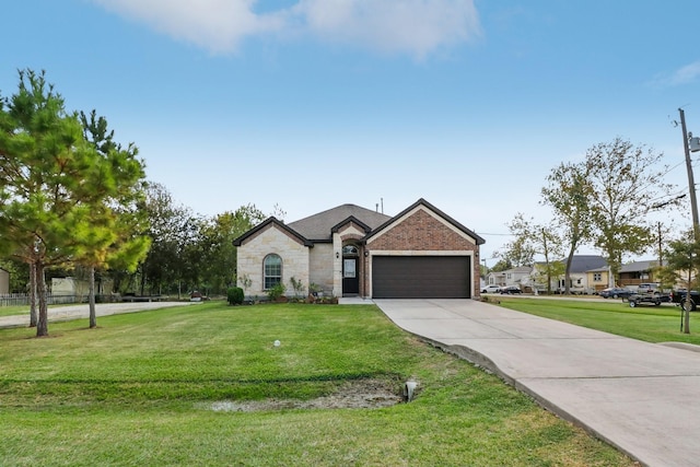 311 W Independence Dr, League City, TX 77573 - french provincial home with an attached garage, concrete driveway, brick siding, and stone siding