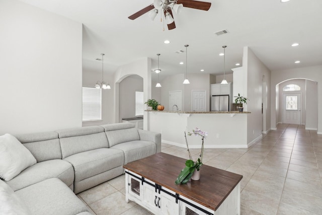 311 W Independence Dr, League City, TX 77573 - living area featuring arched walkways, ceiling fan, light tile patterned flooring, recessed lighting, and baseboards