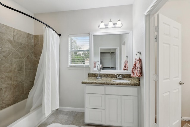 311 W Independence Dr, League City, TX 77573 - full bathroom featuring vanity, shower / bath combo with shower curtain, and baseboards
