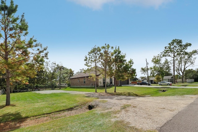 311 W Independence Dr, League City, TX 77573 - view of property's community with a lawn and driveway