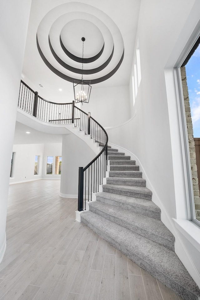 24727 Lobelia Garden Ln, Katy, TX 77493 - stairs with baseboards, plenty of natural light, a towering ceiling, and recessed lighting