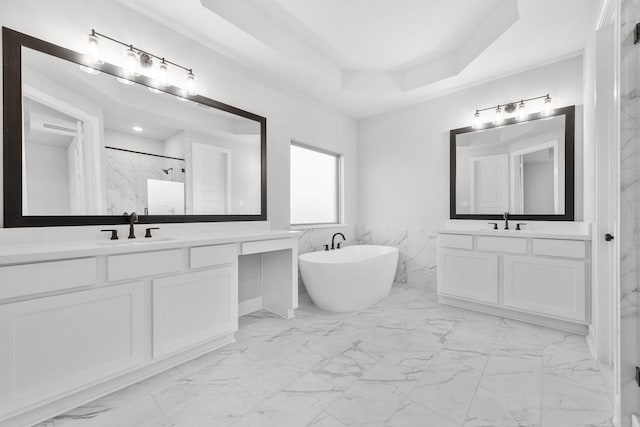 24727 Lobelia Garden Ln, Katy, TX 77493 - bathroom with marble finish floors, a marble finish shower, a freestanding bath, and two vanities