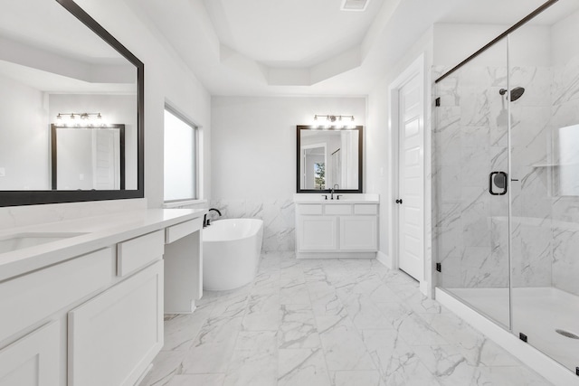 24727 Lobelia Garden Ln, Katy, TX 77493 - full bathroom featuring a marble finish shower, marble finish floors, a freestanding tub, two vanities, and a raised ceiling