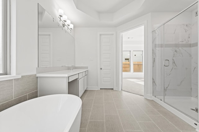 24718 Harrow Meadow Dr, Katy, TX 77493 - full bathroom with a freestanding tub, vanity, and a marble finish shower