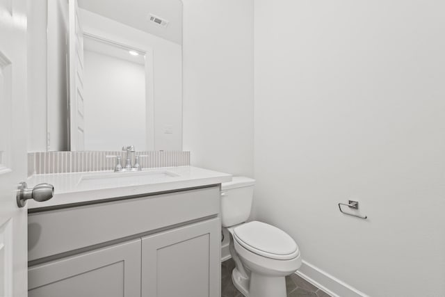 24718 Harrow Meadow Dr, Katy, TX 77493 - half bath with vanity, baseboards, and toilet