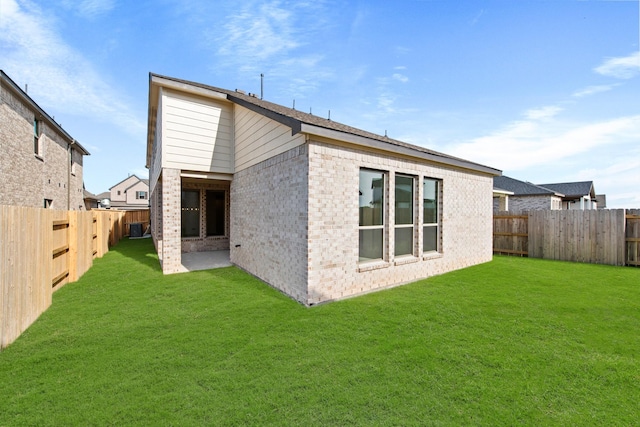 24718 Harrow Meadow Dr, Katy, TX 77493 - rear view of house featuring brick siding and a patio