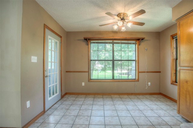 200 Cove View Dr, Trinity, TX 75862 - spare room featuring a textured ceiling, ceiling fan, and baseboards