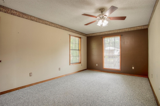 200 Cove View Dr, Trinity, TX 75862 - empty room with carpet floors, ceiling fan, a textured ceiling, and baseboards