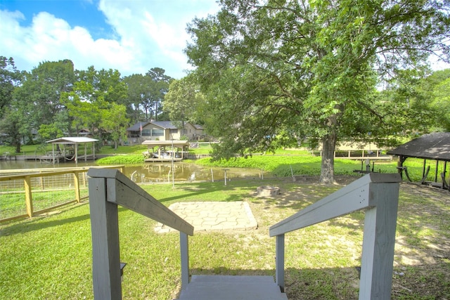 200 Cove View Dr, Trinity, TX 75862 - view of green lawn with a gazebo and a water view