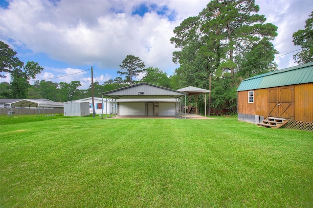 200 Cove View Dr, Trinity, TX 75862 - view of yard featuring a garage, an outdoor structure, and entry steps
