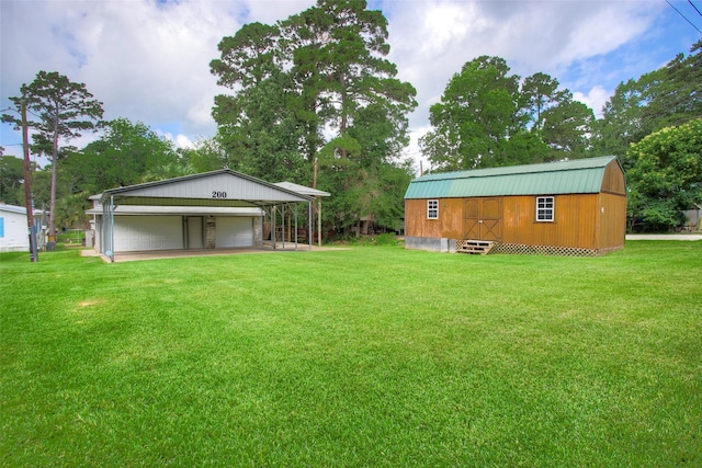 200 Cove View Dr, Trinity, TX 75862 - view of grassy yard featuring an outdoor structure and a detached garage
