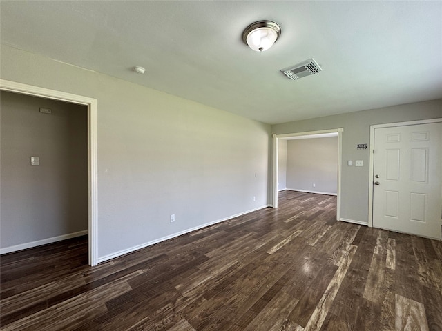 1206 Houston Ave, Pasadena, TX 77502 - unfurnished room featuring dark wood-style floors and baseboards