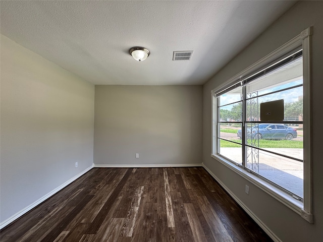1206 Houston Ave, Pasadena, TX 77502 - empty room featuring wood finished floors, baseboards, and a textured ceiling