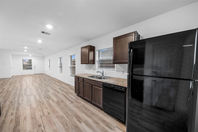 4331 Cedar Elm St, Baytown, TX 77521 - kitchen featuring black appliances, a sink, dark brown cabinetry, light countertops, and light wood finished floors