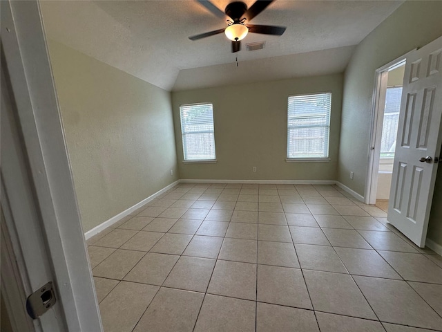 19119 Field Cottage Ln, Richmond, TX 77407 - unfurnished room featuring vaulted ceiling, a ceiling fan, light tile patterned floors, and baseboards