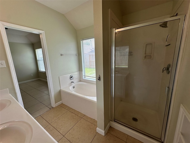 19119 Field Cottage Ln, Richmond, TX 77407 - full bath featuring plenty of natural light, a bath, tile patterned floors, a shower stall, and lofted ceiling