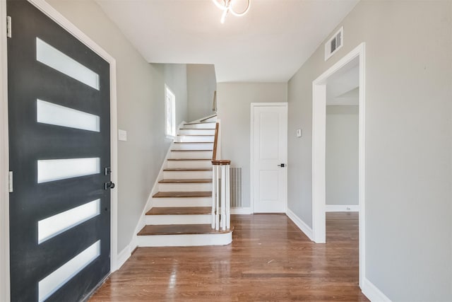 5419 Palmer St, Houston, TX 77004 - entryway with wood finished floors, stairway, and baseboards