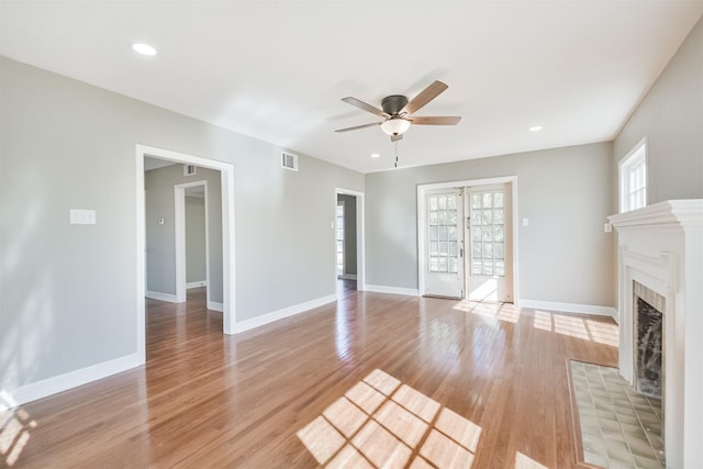5419 Palmer St, Houston, TX 77004 - unfurnished living room with a ceiling fan, a fireplace with flush hearth, baseboards, light wood-type flooring, and recessed lighting