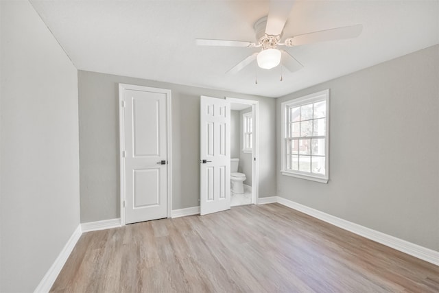 5419 Palmer St, Houston, TX 77004 - unfurnished bedroom featuring light wood-style flooring, baseboards, ensuite bath, and a ceiling fan
