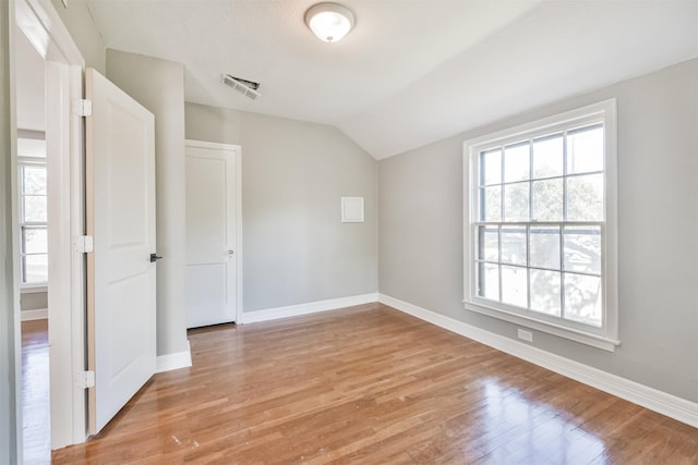 5419 Palmer St, Houston, TX 77004 - empty room with vaulted ceiling, light wood-type flooring, and baseboards