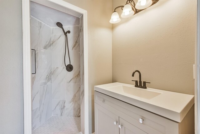 5419 Palmer St, Houston, TX 77004 - bathroom featuring a tile shower, vanity, and a chandelier