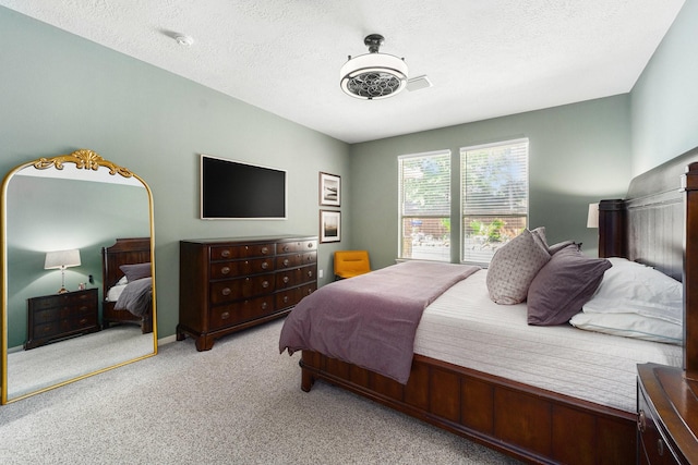 31215 Rainwood Park Ln, Spring, TX 77386 - bedroom featuring carpet floors and a textured ceiling