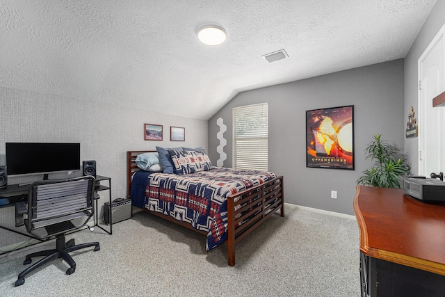 31215 Rainwood Park Ln, Spring, TX 77386 - bedroom featuring lofted ceiling, a textured ceiling, light colored carpet, an office area, and baseboards