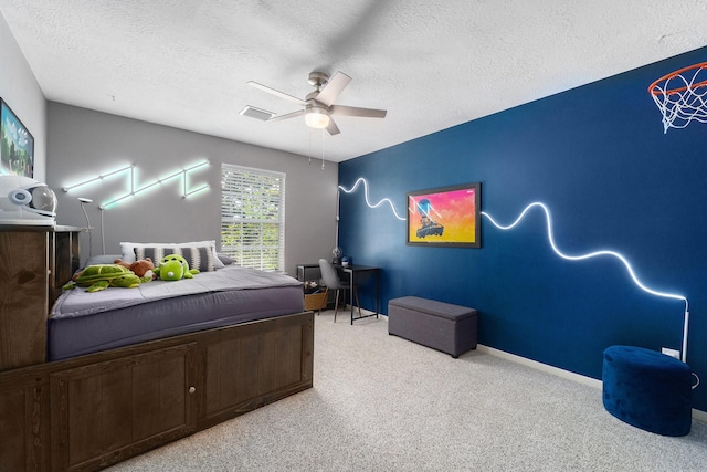 31215 Rainwood Park Ln, Spring, TX 77386 - bedroom with a textured ceiling, light carpet, a ceiling fan, and baseboards