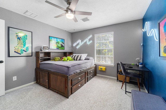 31215 Rainwood Park Ln, Spring, TX 77386 - carpeted bedroom featuring a textured ceiling, baseboards, and ceiling fan