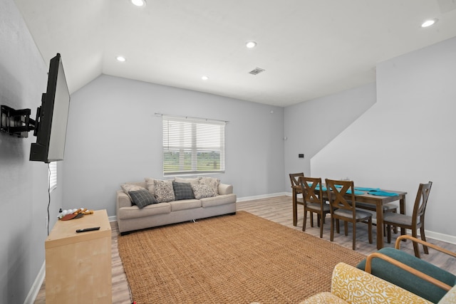 3582 County Road 476, Palacios, TX 77465 - living room with light wood-style flooring, baseboards, and recessed lighting
