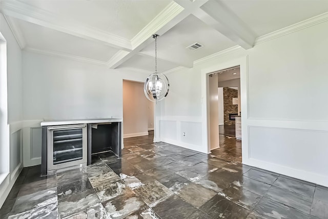 406 Westwood Dr, Friendswood, TX 77546 - unfurnished dining area with wine cooler, a decorative wall, beam ceiling, coffered ceiling, and a chandelier