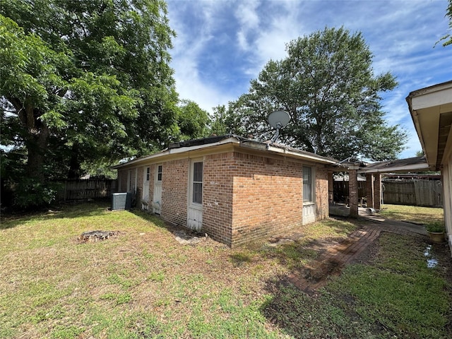 4302 Continental Dr, Houston, TX 77072 - view of side of property with brick siding and central AC unit